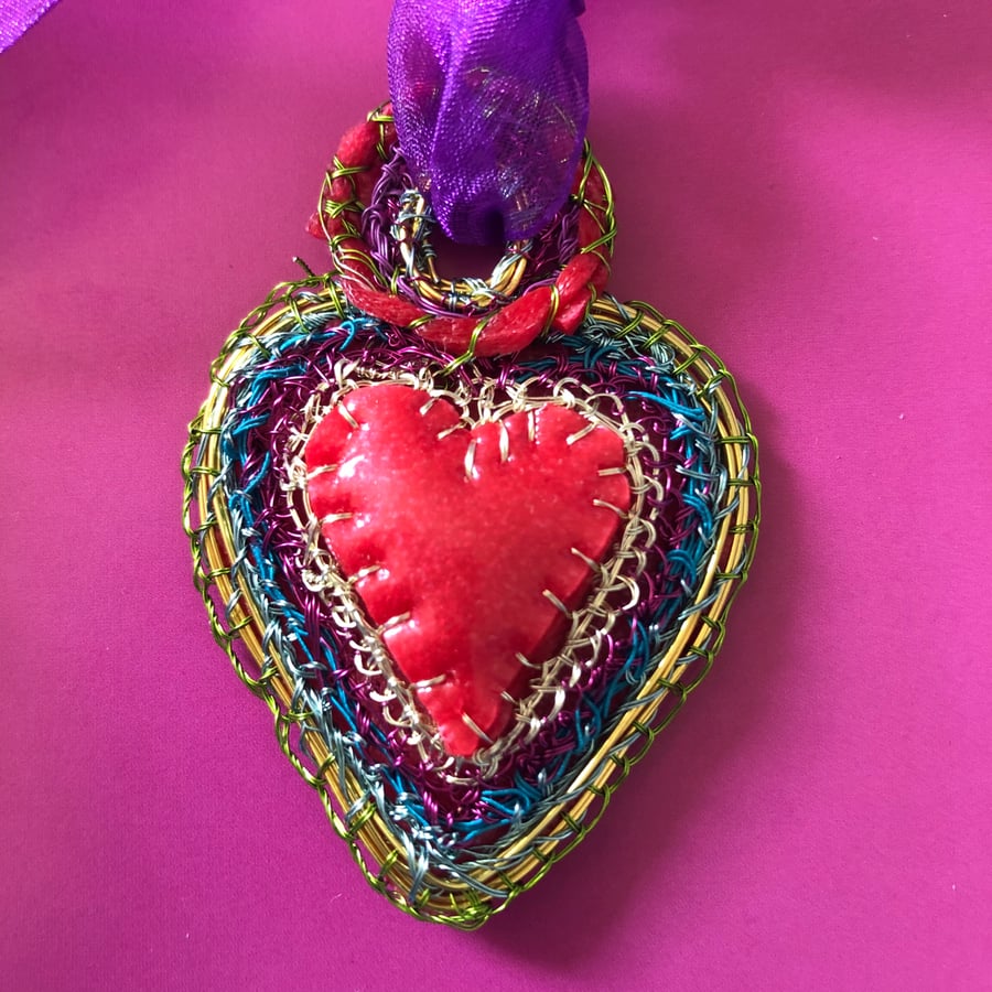 Heart pendant with red rubber 