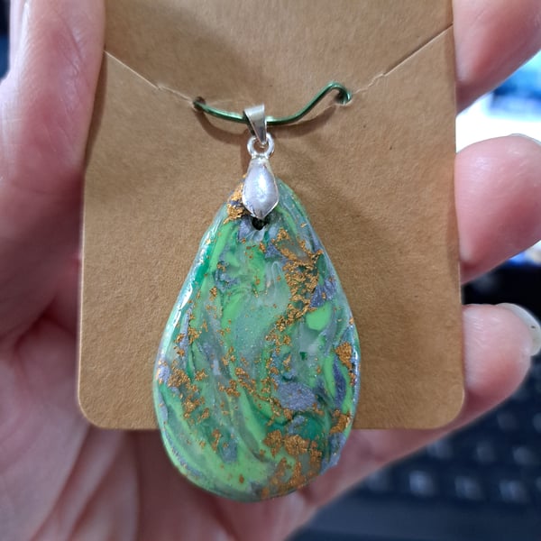 Lovely Oval handmade pendant. Green, translucent white, silver and gold leaf