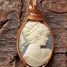 Carved blue and white cameo wire wrapped pendant in copper wire 