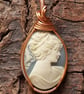Carved blue and white cameo wire wrapped pendant in copper wire 