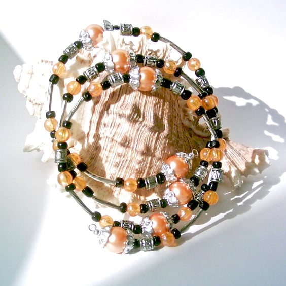 Memory Wire Bracelet of Peach Glass Pearls, Black Beads and Silver-tone Accents