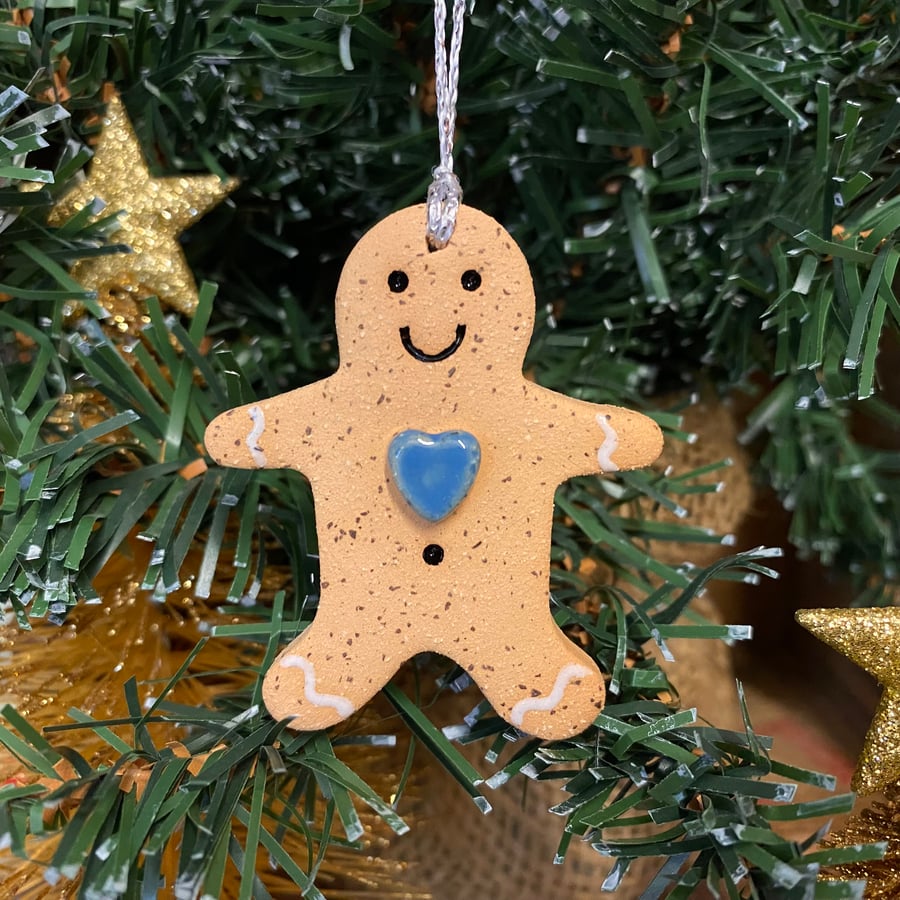 Small pottery gingerbread man with blue heart