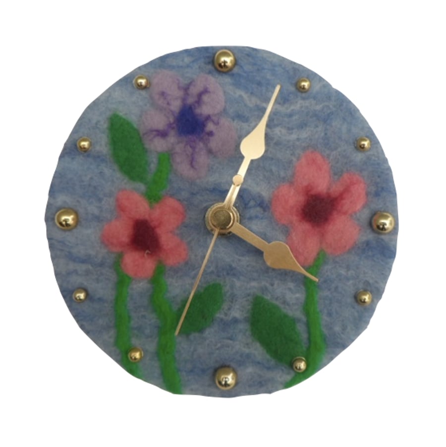 Small clock with felted face in floral design