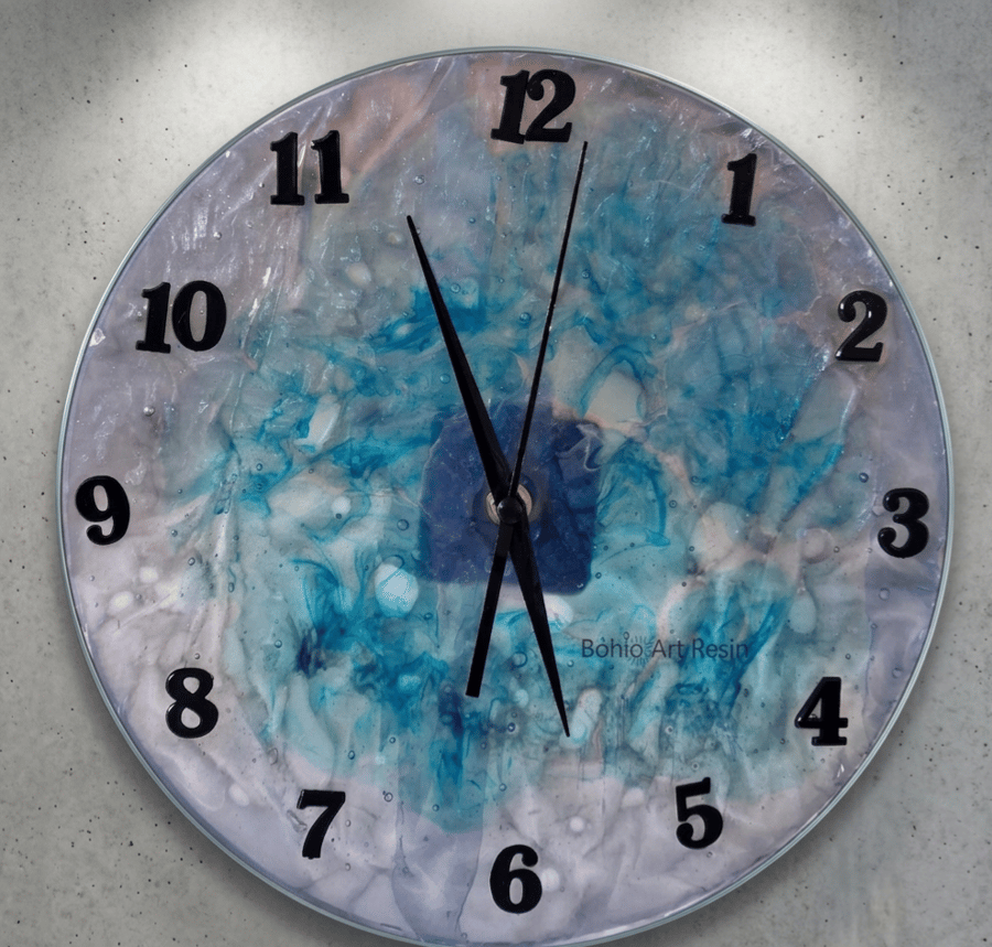 Handmade epoxy resin clock with hanger. Battery operated.