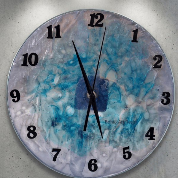 Handmade epoxy resin clock with hanger. Battery operated.