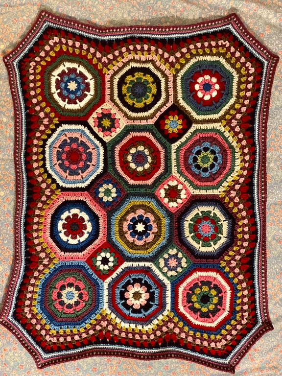 Small crocheted baby blanket. 