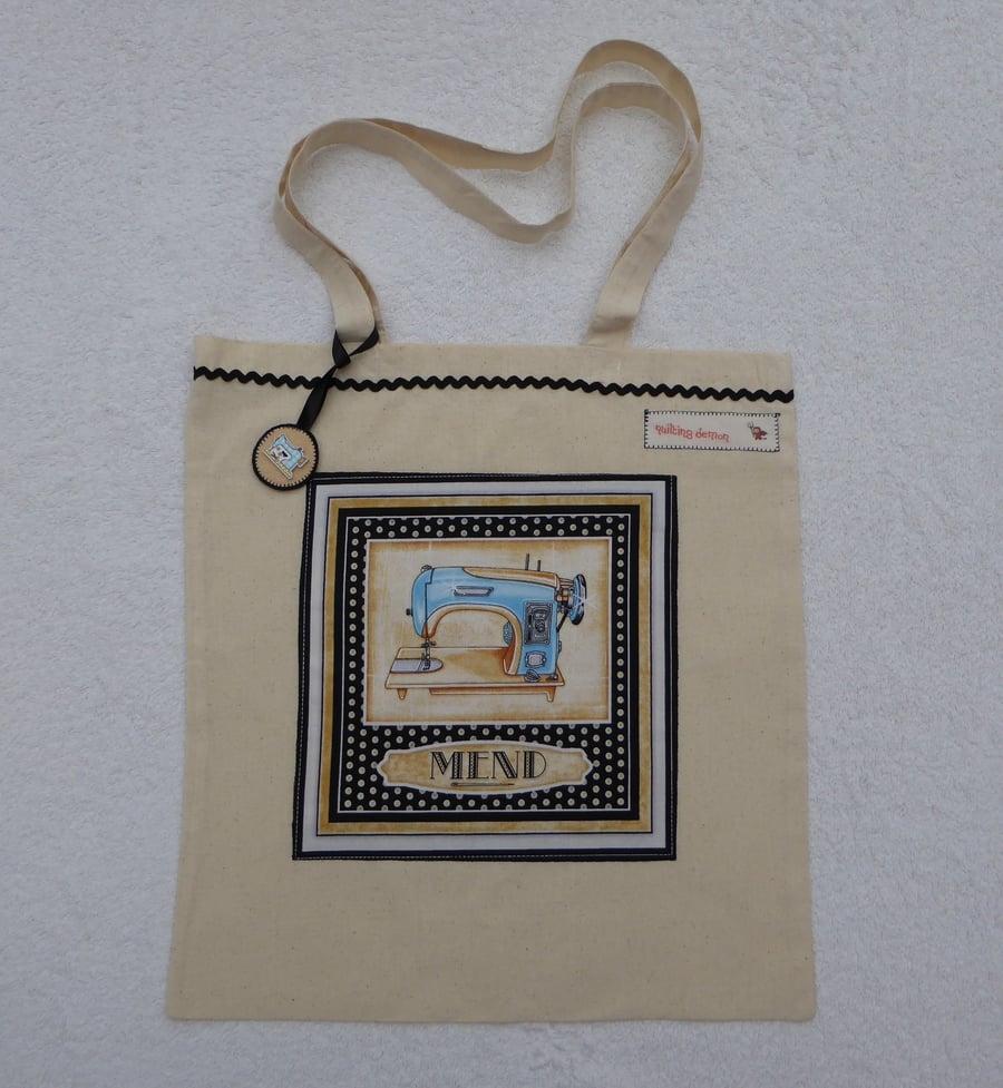 Cotton Canvas Bag with Sewing Machine Applique Panel and Bag Charm. Blue machine