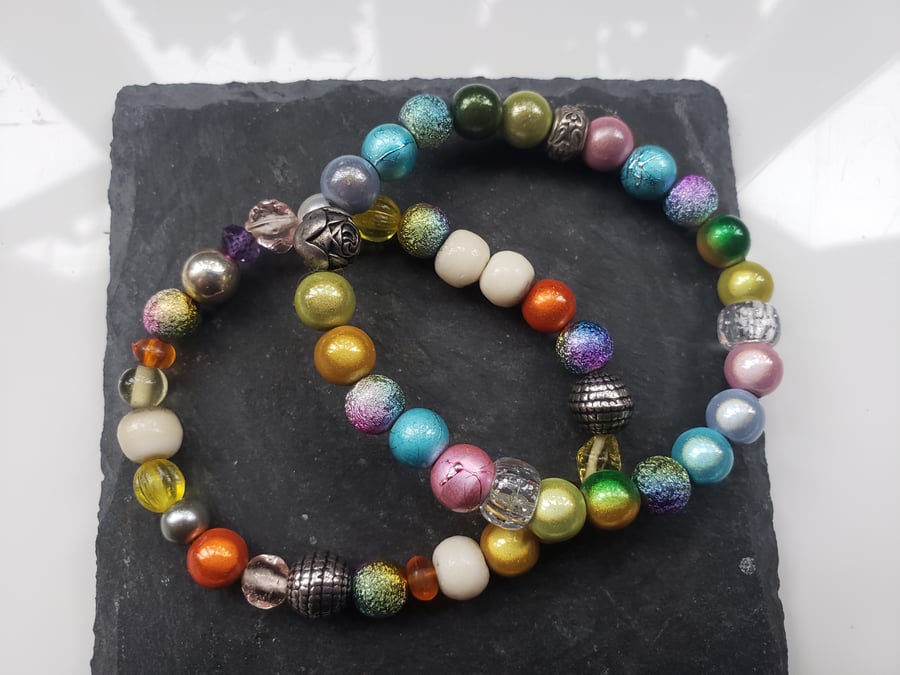 Two colourful beaded stretch bracelets