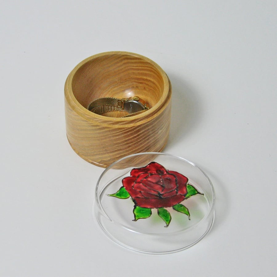 A trinket pot in glass and wood