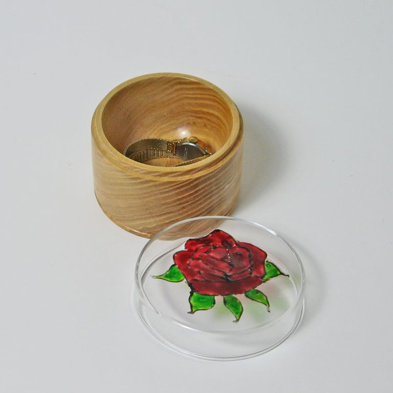 A trinket pot in glass and wood