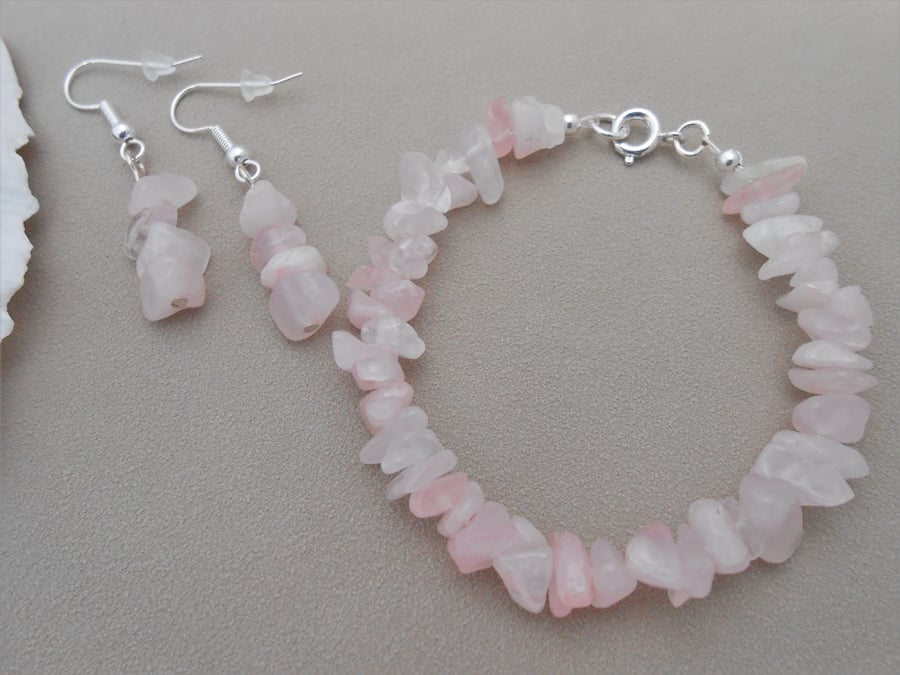 Rose quartz bracelet and earrings set in silver plate.