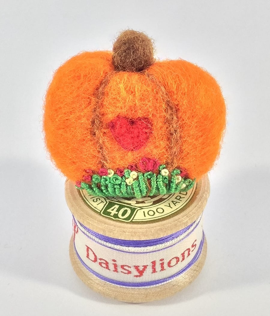 Pumpkin brooch.