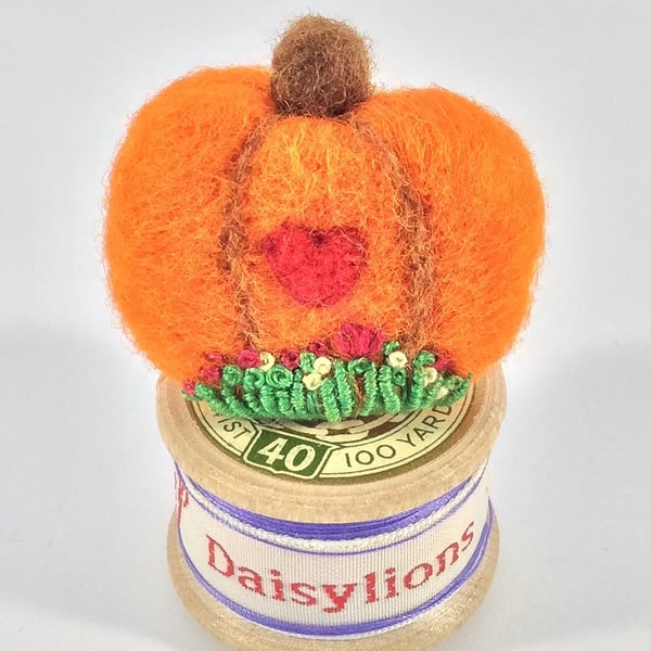 Pumpkin brooch.