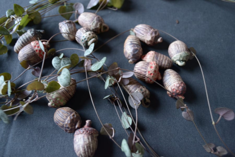 Set of three handmade ceramic acorns