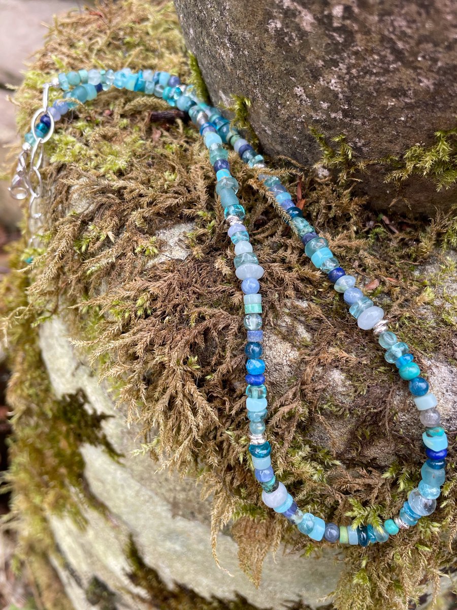 Gemstone and sterling silver bead necklace in blues.