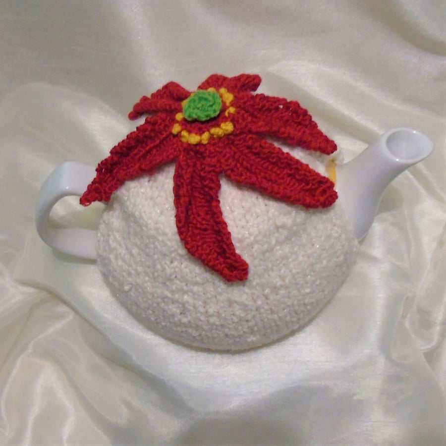 Poinsettia tea cosy, cream sparkle yarn, hand knitted 