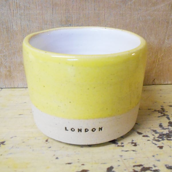 Tumbler London logo in Speckled Yellow.