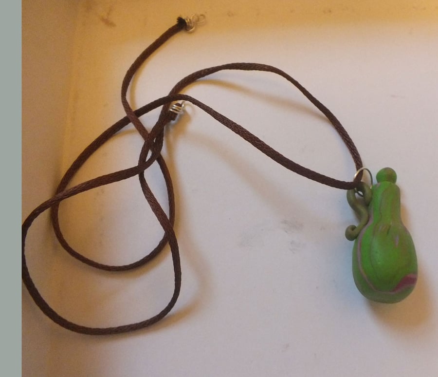green marbled polymer clay bottle pendant