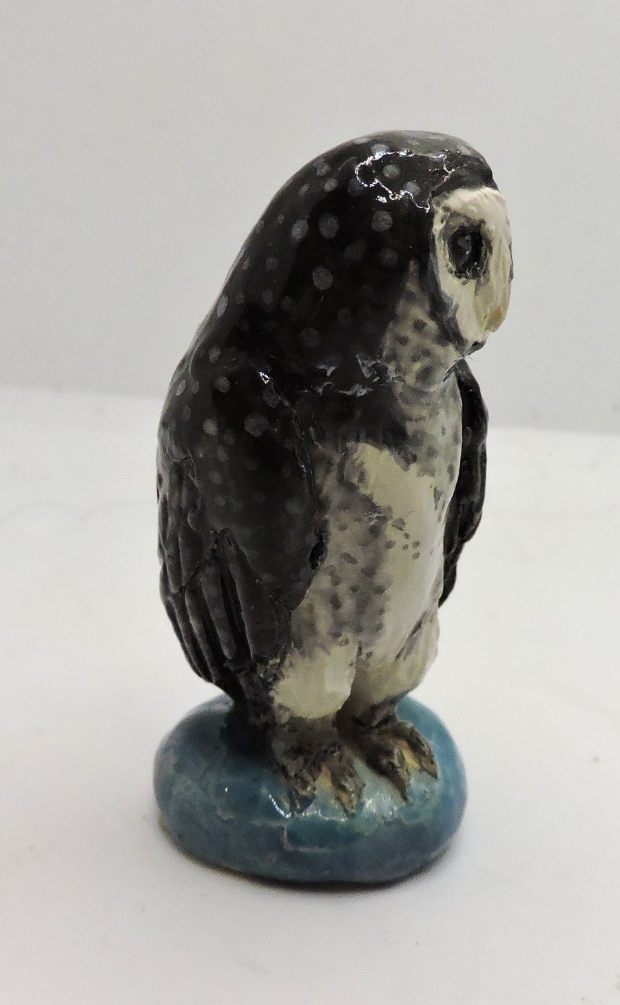 Miniature ceramic sooty owl sculpture 