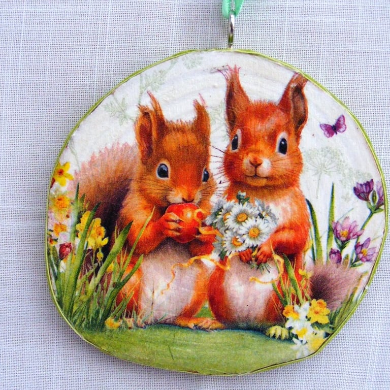 Red Squirrel decoupaged log slice wall decoration.