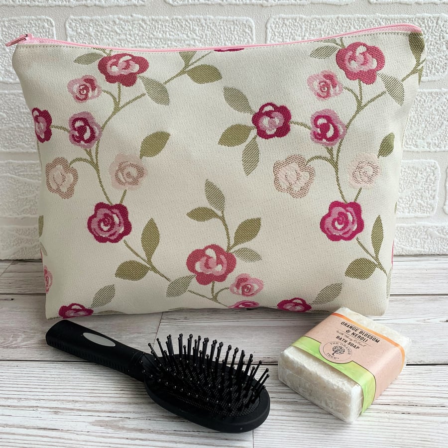 Rambling roses toiletry bag in shades of pink on cream