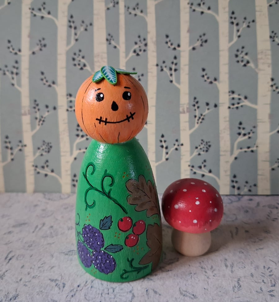 Pumpkin autumn Hand-painted peg doll with toadstools. 