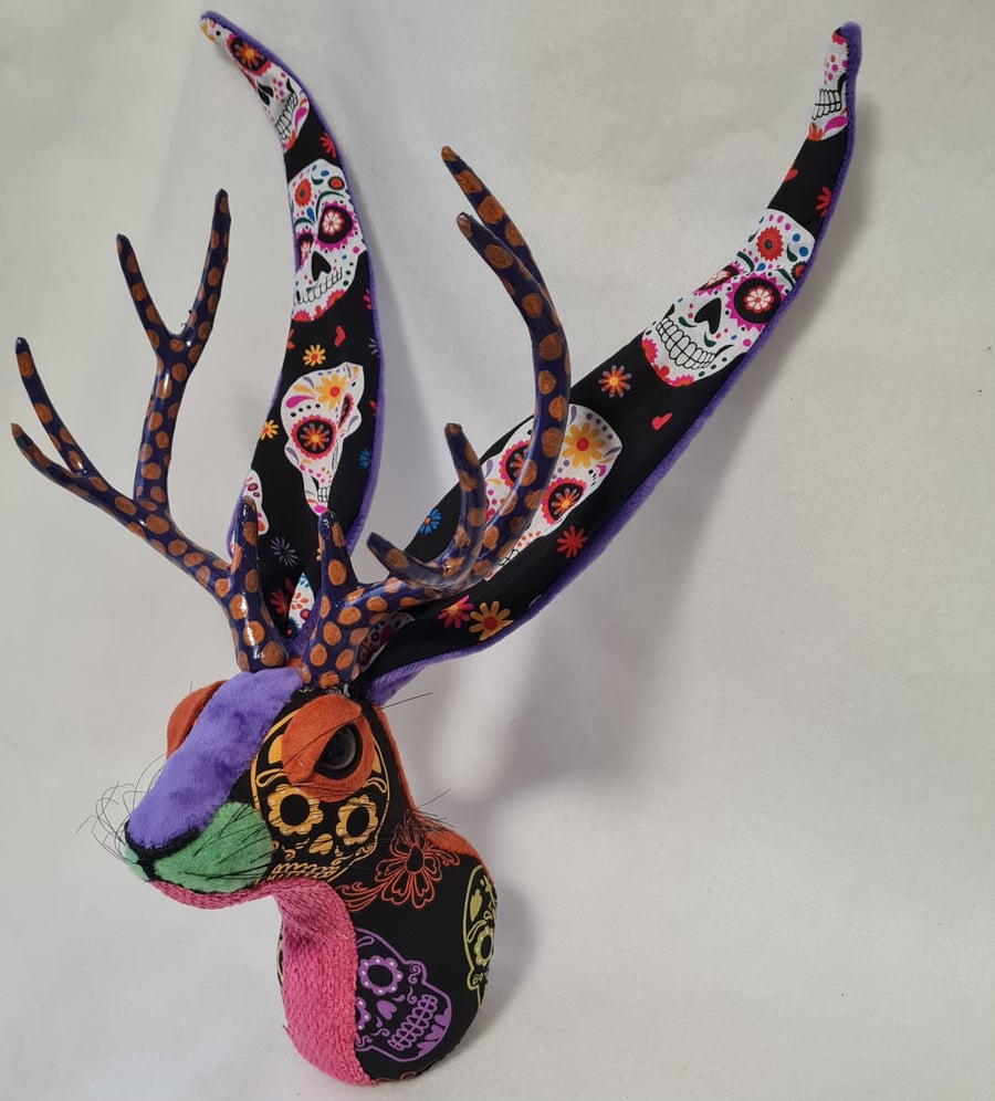 Faux jackalope head wall mount in Day of the Dead skull style fabric
