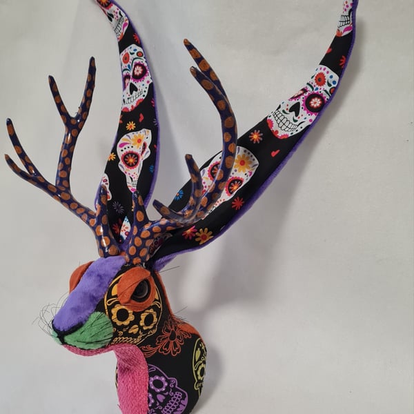 Faux jackalope head wall mount in Day of the Dead skull style fabric