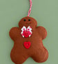 Handmade Felt Gingerbread Christmas Decoration – Red Hearts & Festive Bow