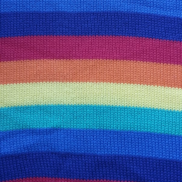 Baby blanket in rainbow striped cotton. Plain back, reversible.