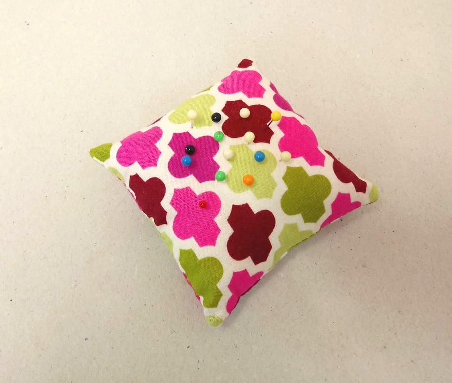 Pin cushion in bright pink and green, square shape, sewing accessory