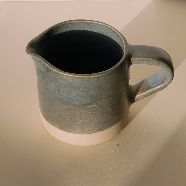 Small studio pottery jug in stoneware clay