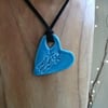 Large CeramicTurquoise Pendant Heart Necklace Impressed with  flowers.