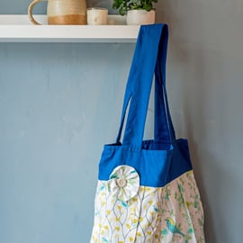 Bird print tote bag with flower button detail