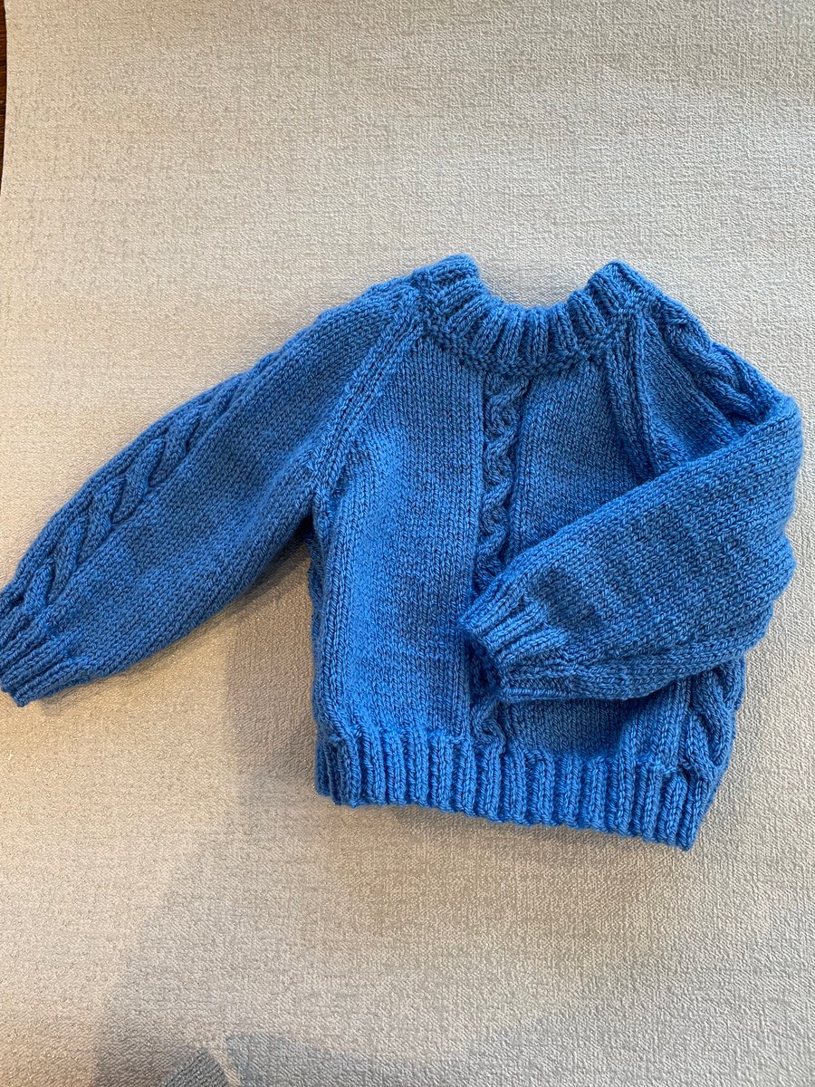 Jumper with cable panels