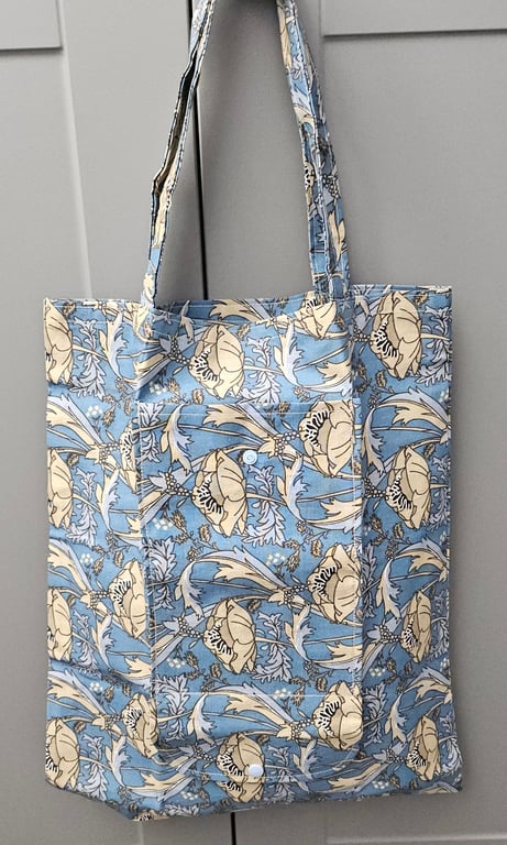 Blue floral fold up tote bag.