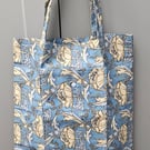 Blue floral fold up tote bag.