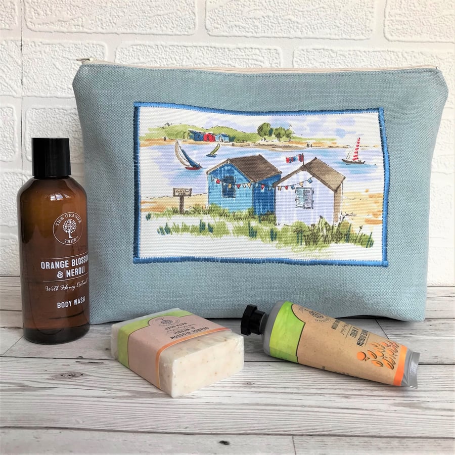 Beach huts toiletry bag, wash bag in pale blue with beach huts print panel