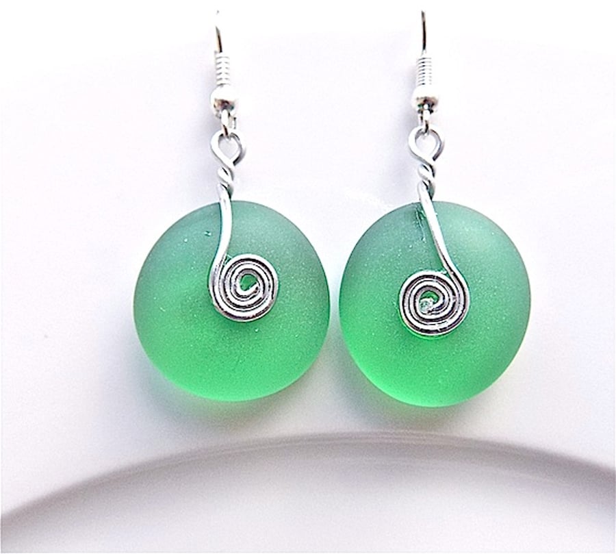 Pale emerald green sea glass dangle earrings, for pierced ears.
