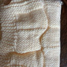 Beautiful cream baby blanket handknitted in Hayfield Baby Chunky wool