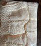 Beautiful cream baby blanket handknitted in Hayfield Baby Chunky wool