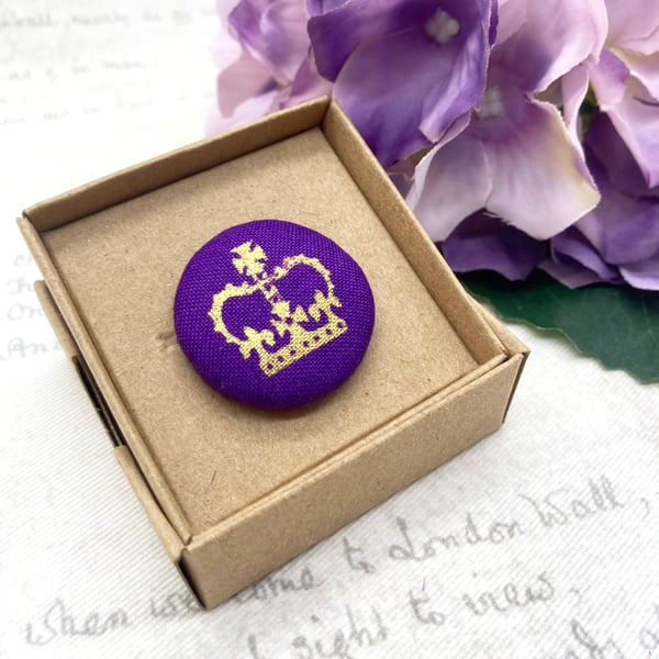 Gold crown on purple fabric button brooch royal celebrations