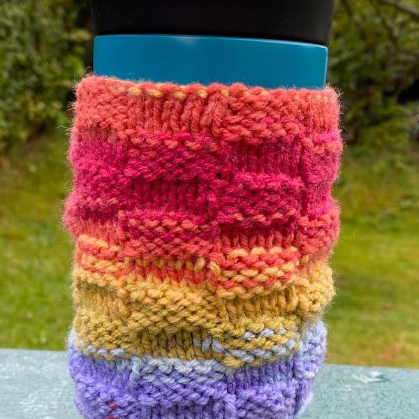 Handknitted travel mug colourful rainbow cosie