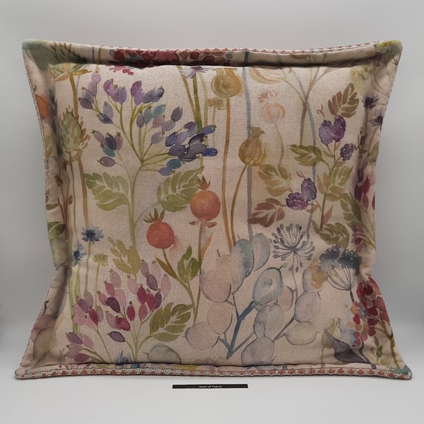 Cushion cover  in beige floral with flange edge.