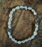 Pearl bracelet with silver skull 