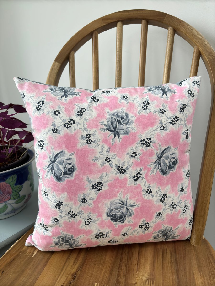 Floral cushion cover in a pretty wild rose print in pink and grey, 40cm x 40cm