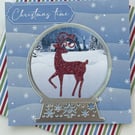 Glittery stag in a snow globe Christmas time card