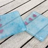 Fused glass coasters in bubble glass with copper hearts 