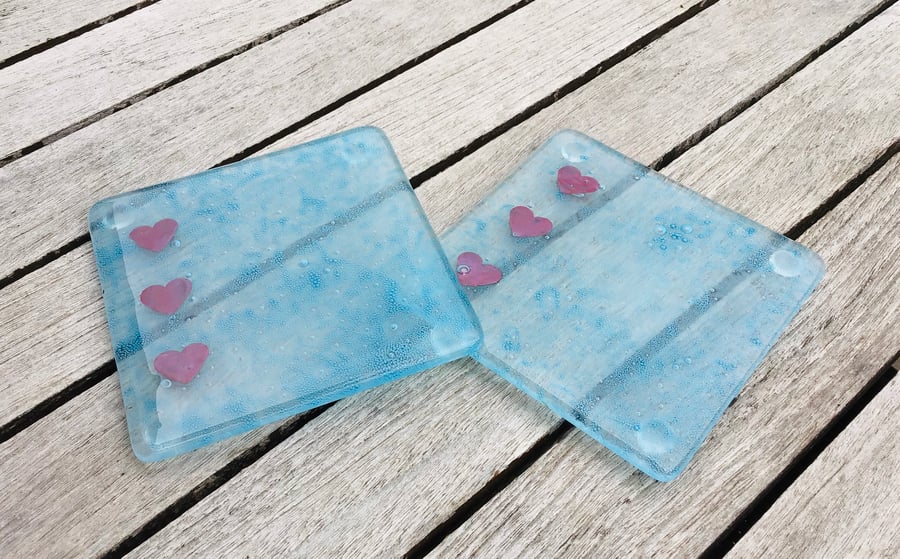 Fused glass coasters in bubble glass with copper hearts 
