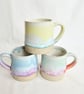 A handmade stoneware mug in yellow, green and oatmeal - Image 7